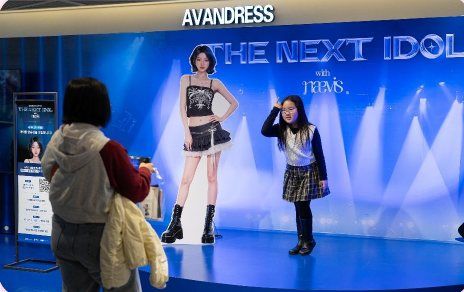 Visitors try an AI experience at Millennial Works’ “The Next Idol” pop-up. Image: Millennial Works