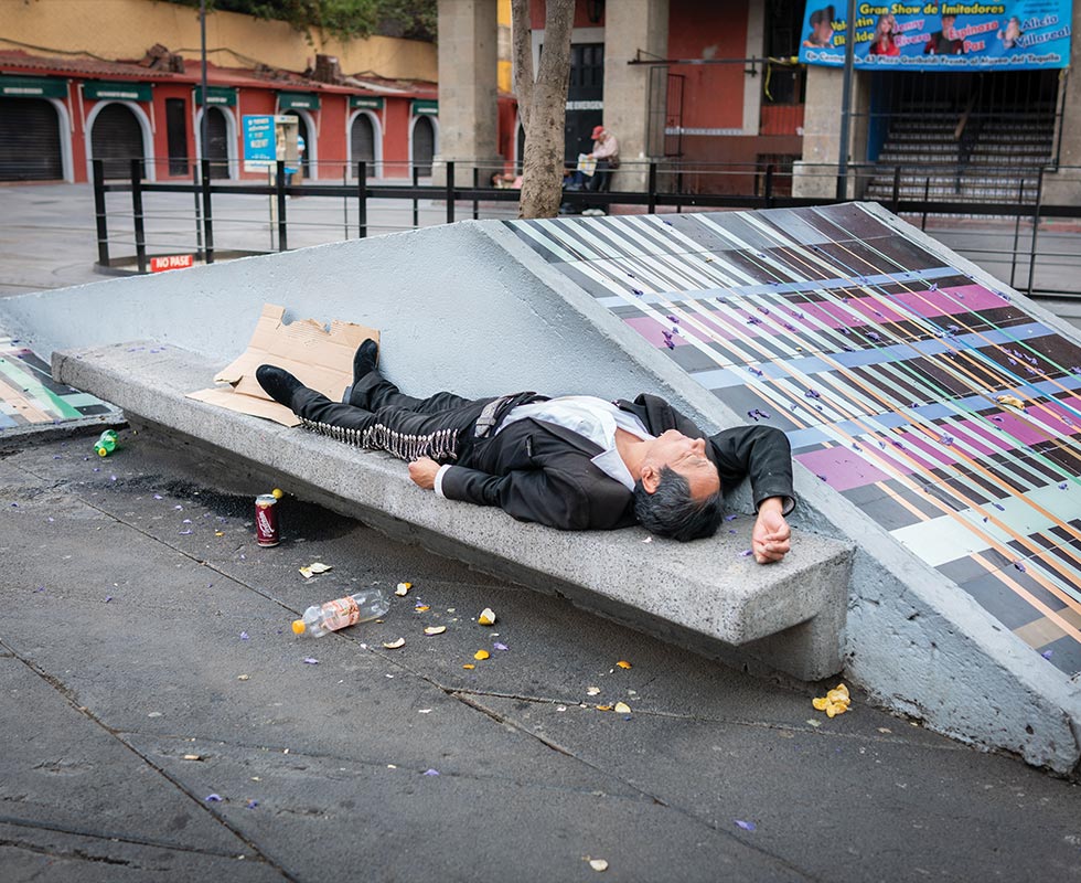 With no work to be had, musicians can now be seen asleep all over the plaza during the daytime.