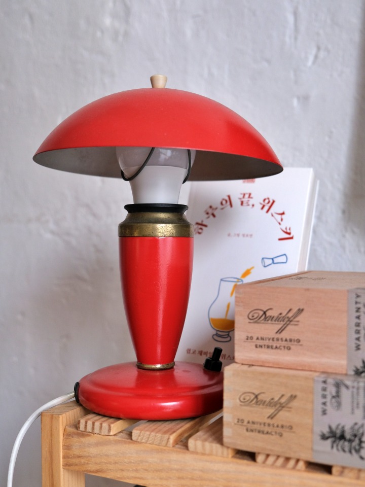 The interior of Boyeonjeong, filled with vintage furniture and lighting