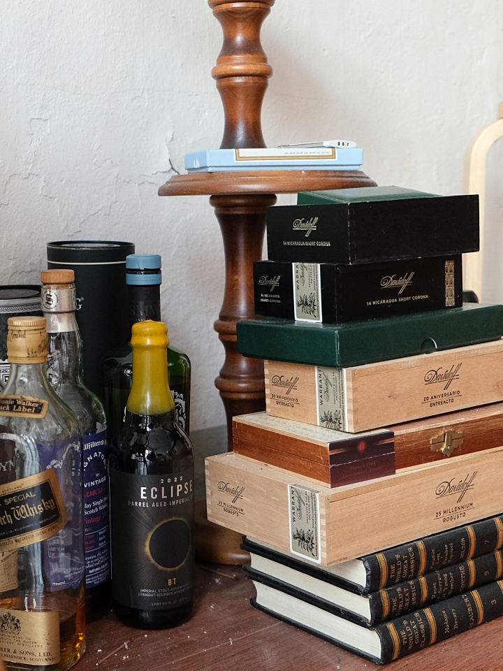 Vintage items and whiskey bottles stacked at Boyeonjeong