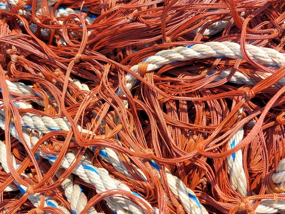 Small Action collecting discarded fishing nets