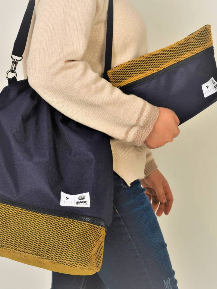 An upcycled bag made from discarded fishing nets, started through crowdfunding