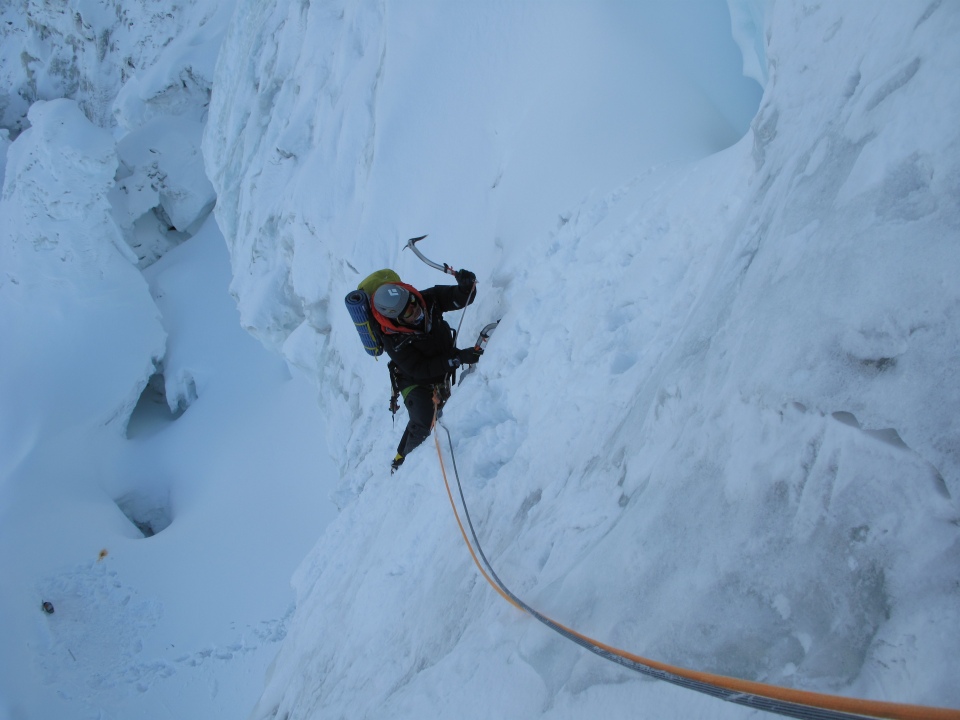 Climber Ahn Chiyeong hanging from a rope.