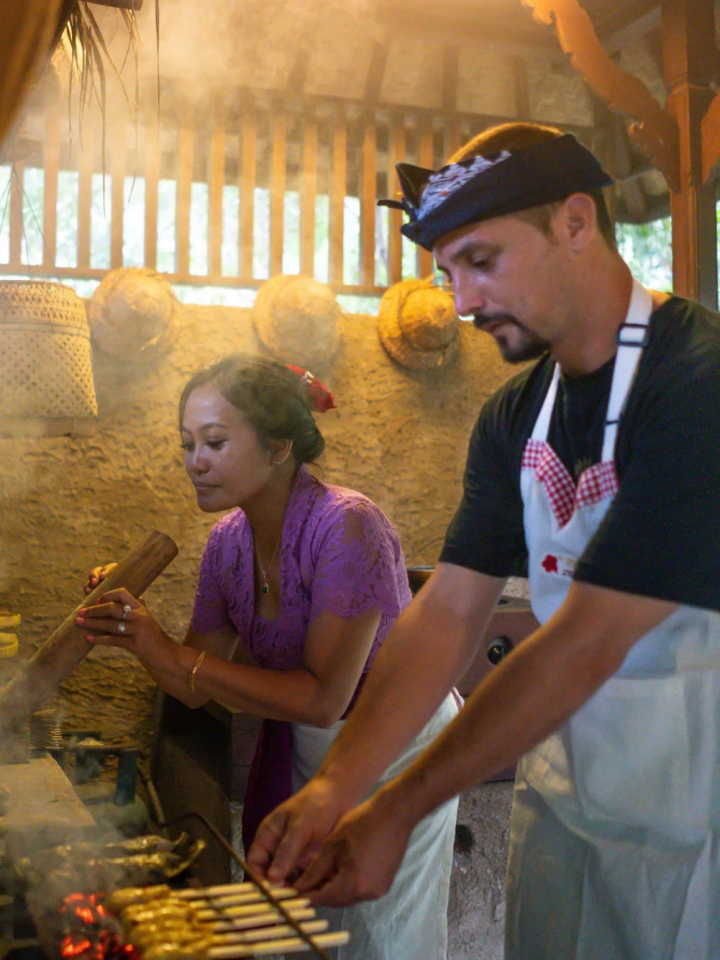 Joining a cooking class to touch and smell Ubud’s abundant ingredients firsthand.